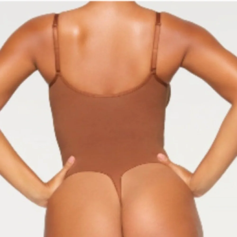 Skims Seamless Sculpting Thong Bodysuit in Bronze